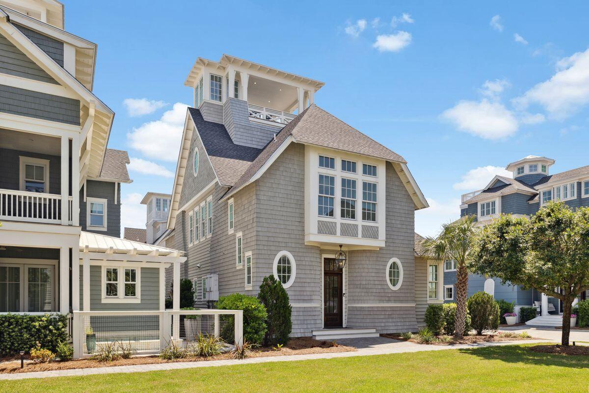 9 Honor Ln Inlet Beach Inlet Beach, FL 32461 - Photo 14 of 55 a front view of a building with a garden and plants