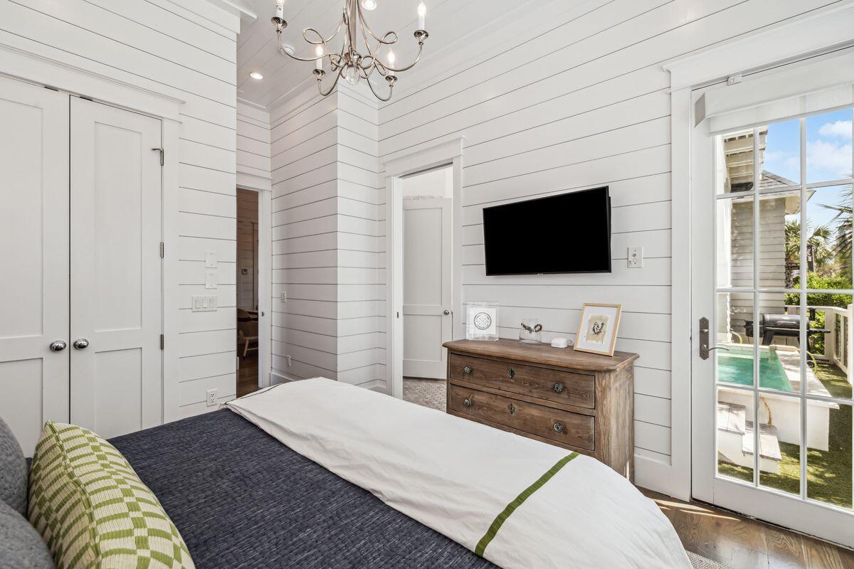 9 Honor Ln Inlet Beach Inlet Beach, FL 32461 - Photo 21 of 55 a bedroom with a bed and a flat screen tv