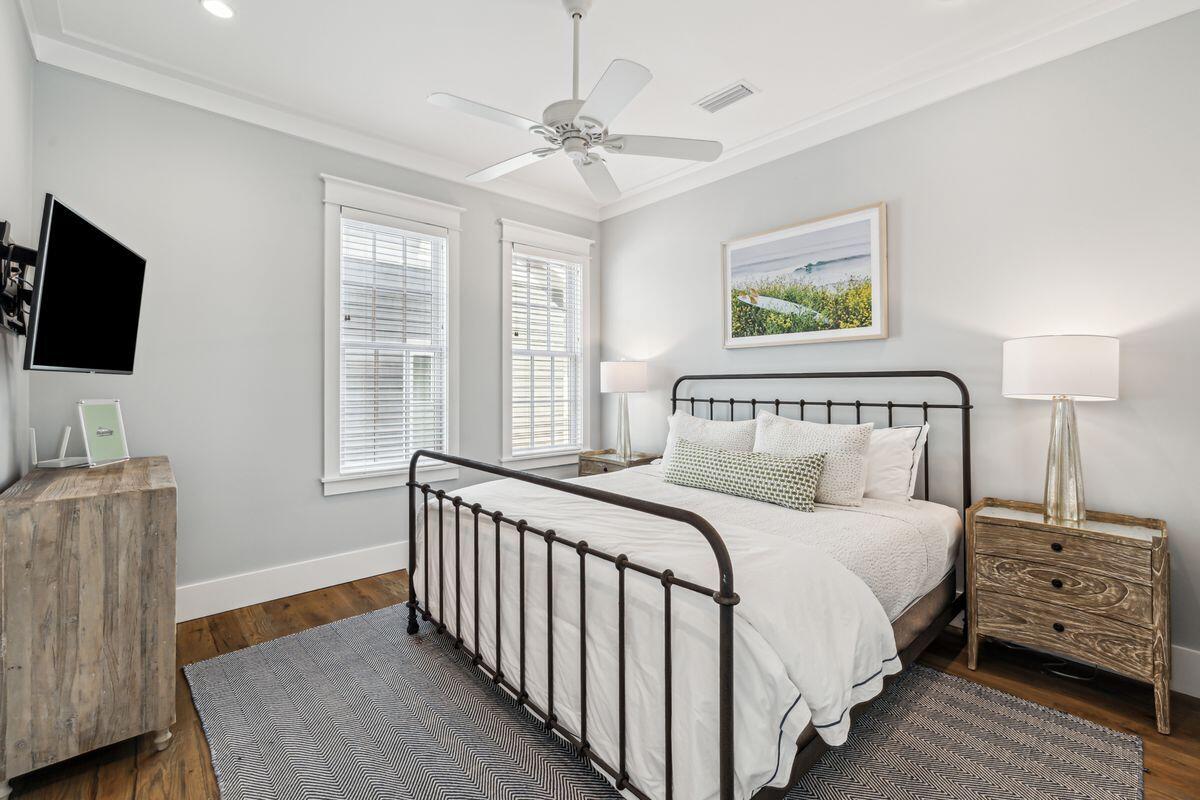 9 Honor Ln Inlet Beach Inlet Beach, FL 32461 - Photo 27 of 55 a bedroom with a bed a couch and a flat tv screen on the dresser