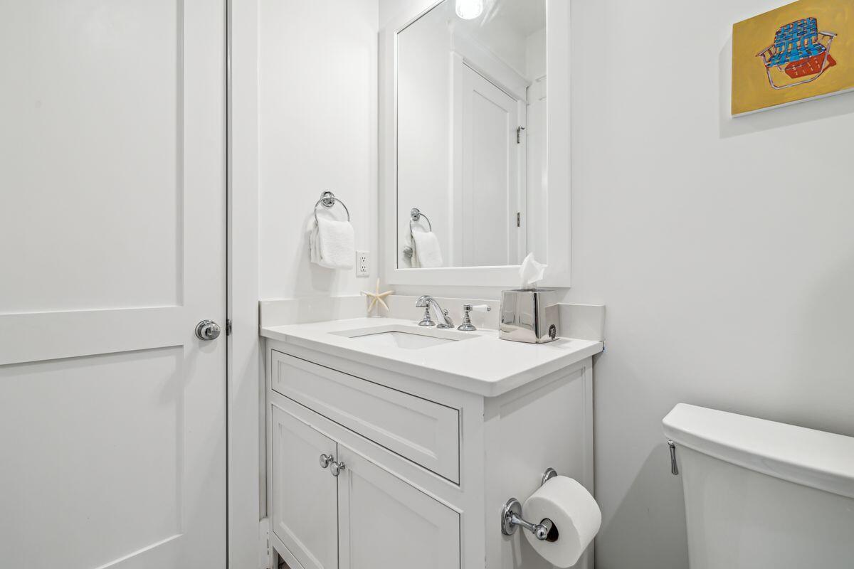 9 Honor Ln Inlet Beach Inlet Beach, FL 32461 - Photo 29 of 55 a bathroom with a sink a toilet and a mirror