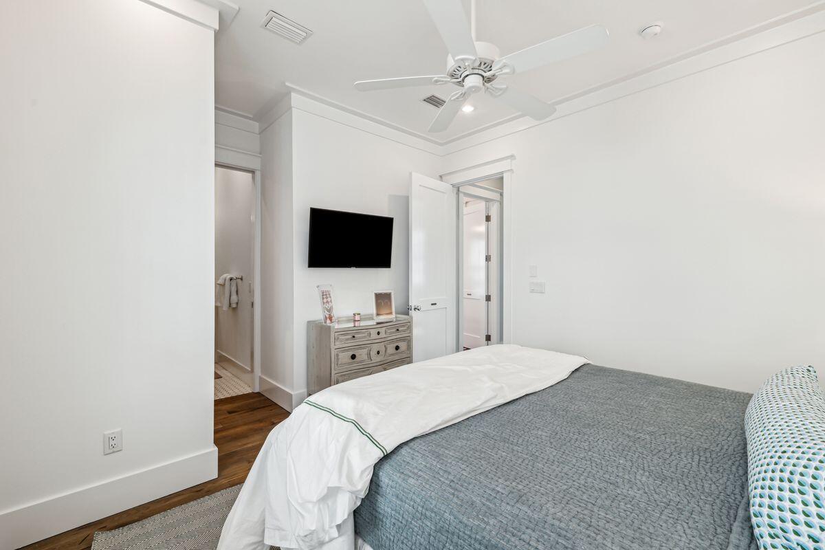 9 Honor Ln Inlet Beach Inlet Beach, FL 32461 - Photo 35 of 55 a bedroom with a bed and a flat screen tv