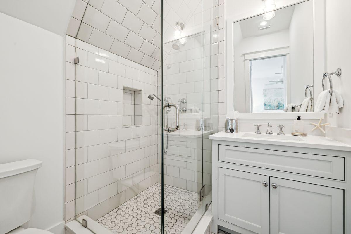 9 Honor Ln Inlet Beach Inlet Beach, FL 32461 - Photo 36 of 55 a bathroom with a sink a toilet and shower