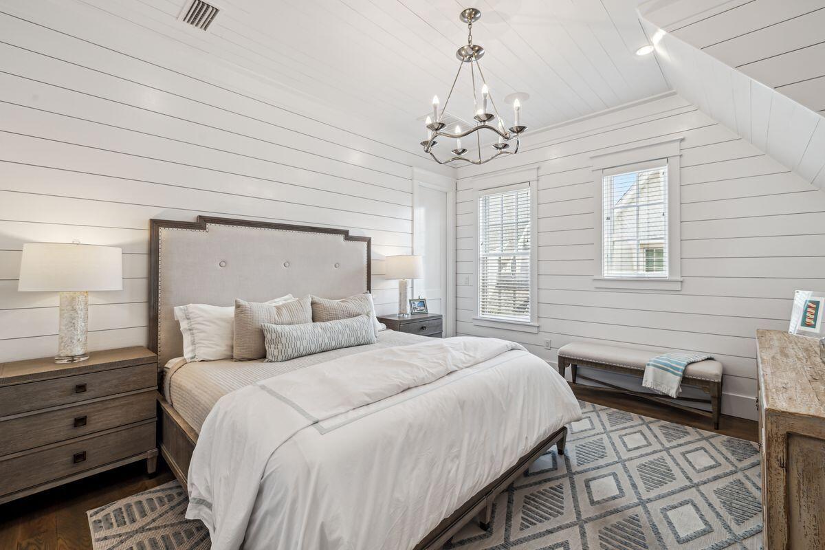 9 Honor Ln Inlet Beach Inlet Beach, FL 32461 - Photo 37 of 55 a spacious bedroom with a bed and a chandelier