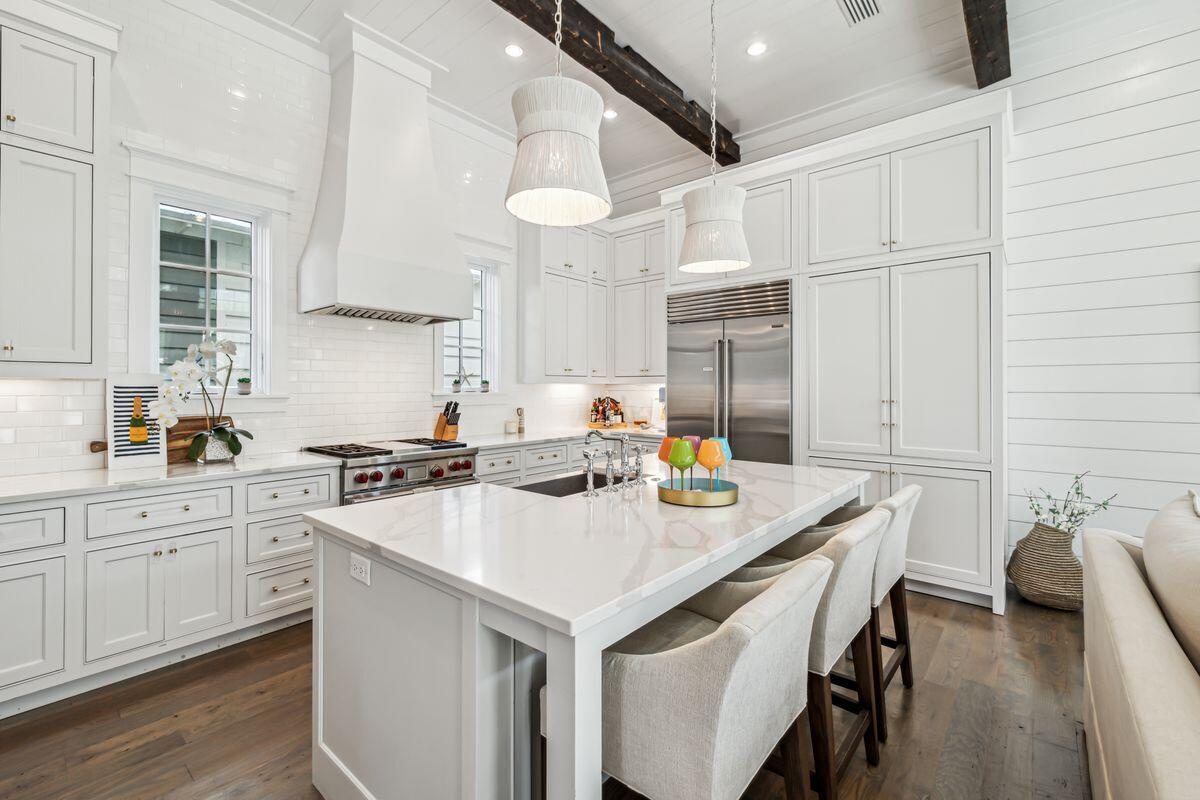 9 Honor Ln Inlet Beach Inlet Beach, FL 32461 - Photo 5 of 55 a kitchen with a sink a stove a refrigerator and white cabinets