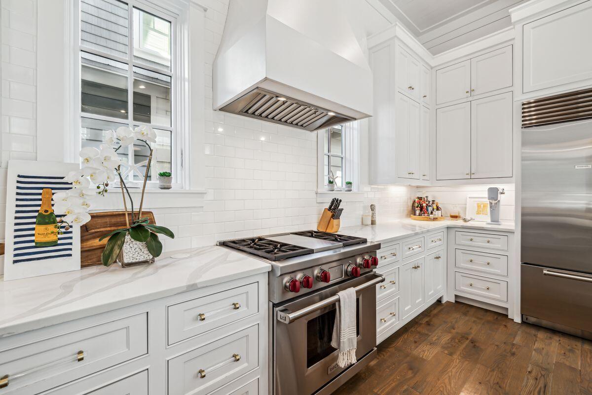 9 Honor Ln Inlet Beach Inlet Beach, FL 32461 - Photo 8 of 55 a kitchen with granite countertop a sink stainless steel appliances and cabinets