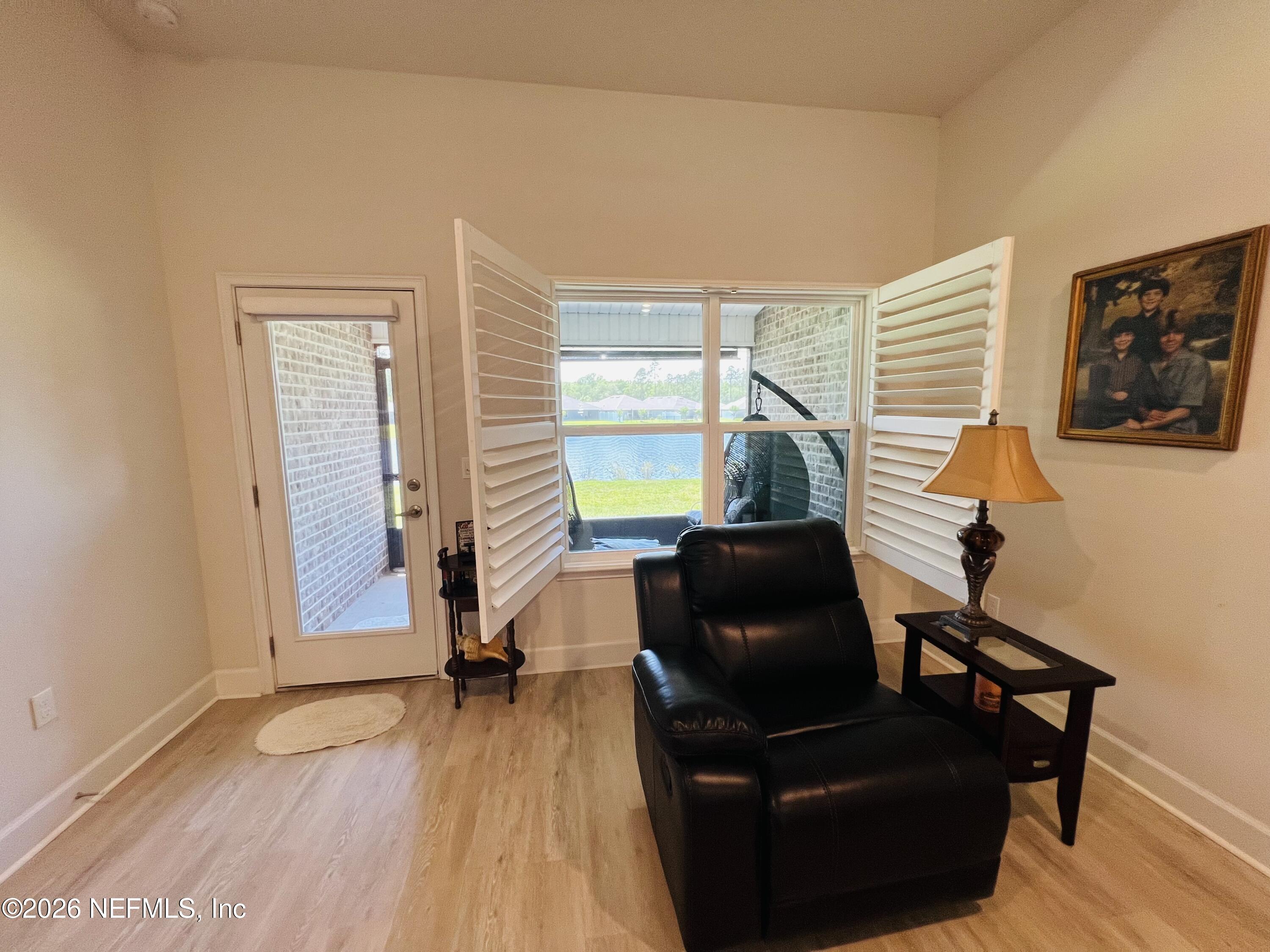 2 Rivertown Road Palm Coast, FL 32137 - Photo 54 of 80 a living room with furniture and a window