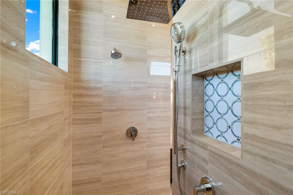 15850 Hampton View Fort Myers, FL 33908 - Photo 19 of 38 Full bath featuring a freestanding bath, vanity, and walk in shower