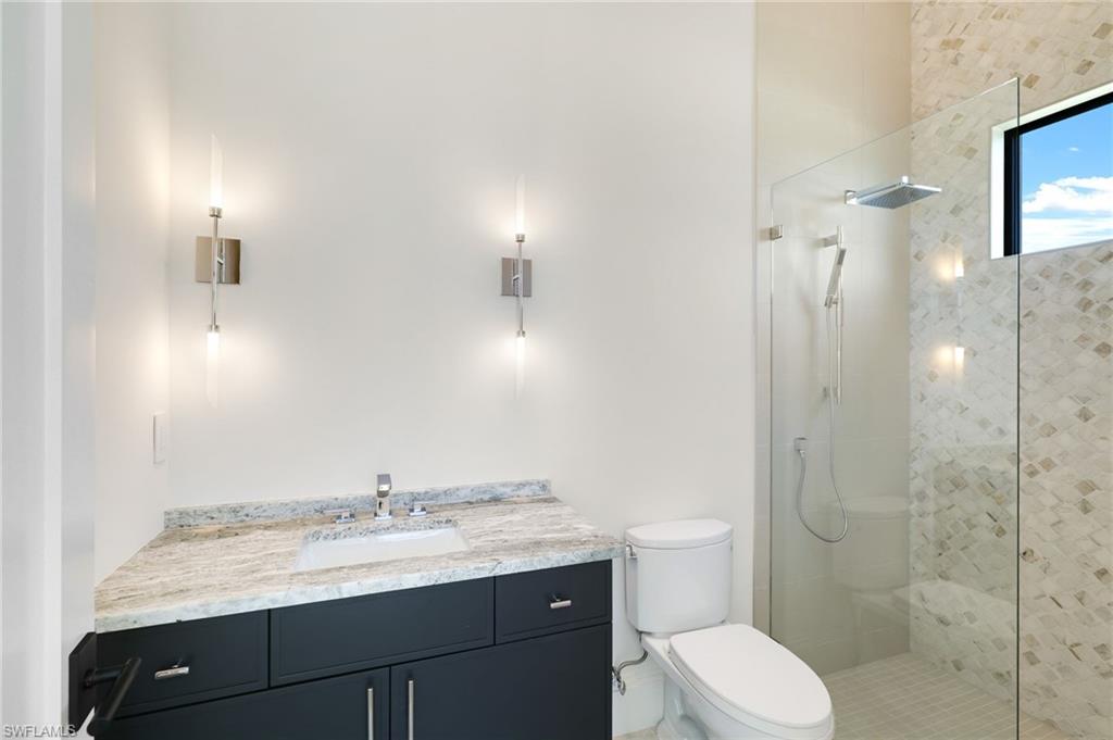 15850 Hampton View Fort Myers, FL 33908 - Photo 28 of 38 Bathroom featuring vanity and wallpapered walls