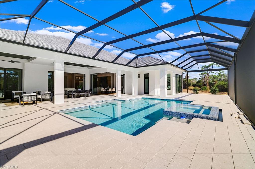 15850 Hampton View Fort Myers, FL 33908 - Photo 30 of 38 Laundry room fI)eaturing light wood-style floors, cabinet space, washer and dryer, and recessed lighting