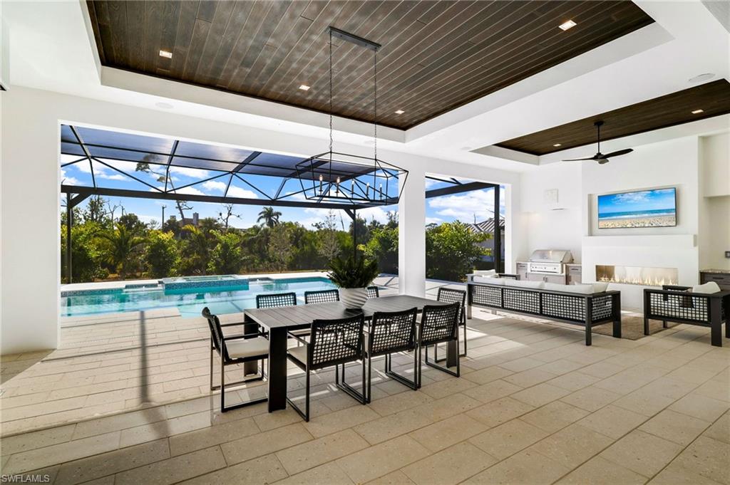 15850 Hampton View Fort Myers, FL 33908 - Photo 33 of 38 Bedroom with access to outside, light wood-style flooring, a sunroom, and ceiling fan