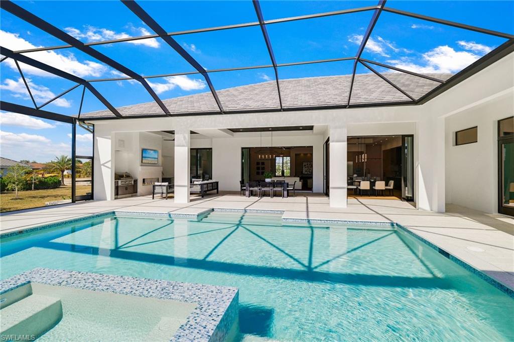 15850 Hampton View Fort Myers, FL 33908 - Photo 35 of 38 Integrated pool / spa featuring a sunroom, a lanai, and a patio area