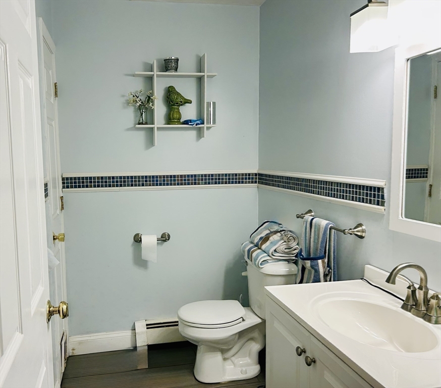 53 Denver Terrace Worcester, MA 01604 - Photo 14 of 19 a bathroom with a toilet sink and mirror