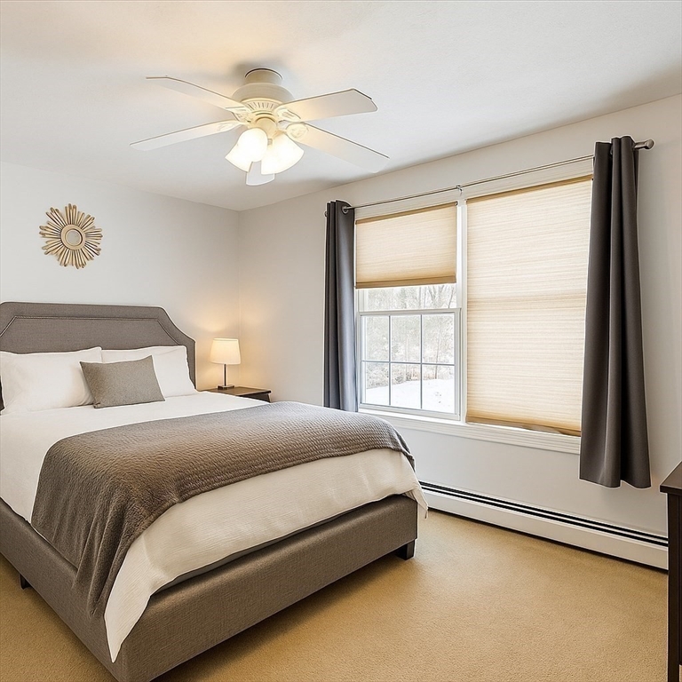 53 Denver Terrace Worcester, MA 01604 - Photo 7 of 19 a bedroom with a large bed and a large window