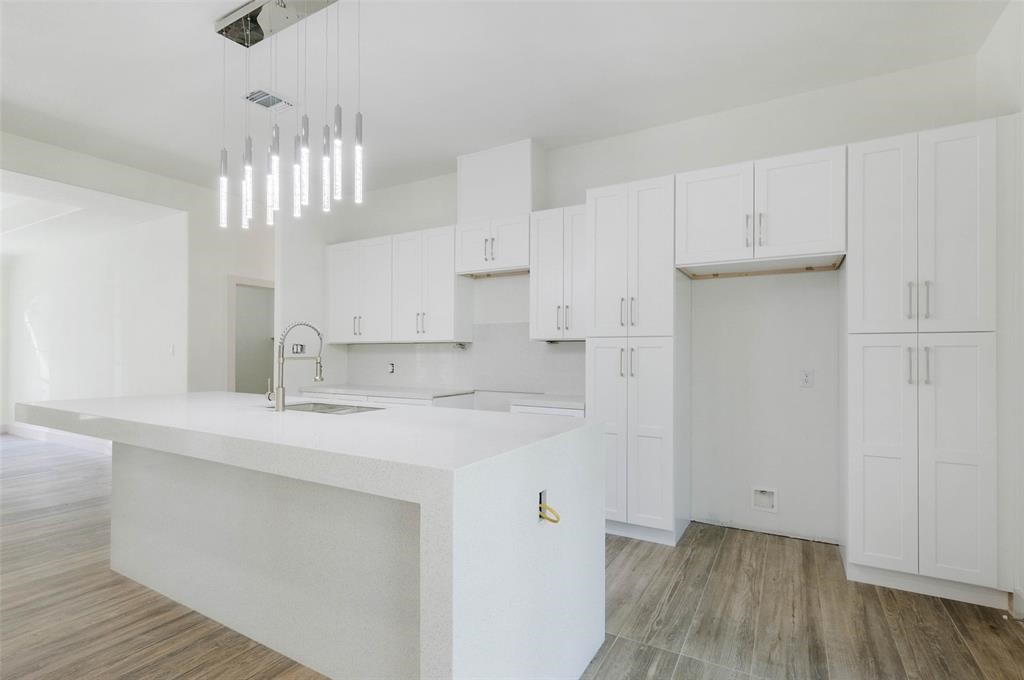 2291 Riverside Drive West Columbia, TX 77486 - Photo 24 of 50 a kitchen with kitchen island a sink stainless steel appliances and cabinets