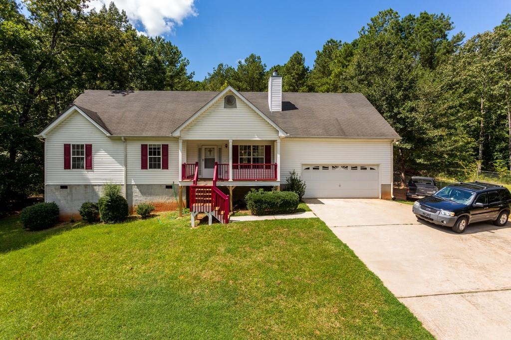 201 Henry Higgins Road Jackson, GA 30233 - Photo 1 of 1 a front view of a house with garden