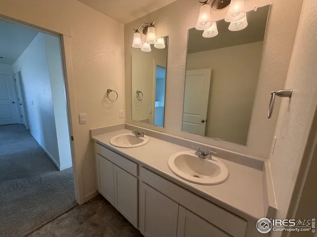 a bathroom with a sink a vanity and a mirror