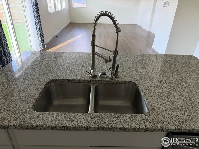 a bathroom with a sink and granite