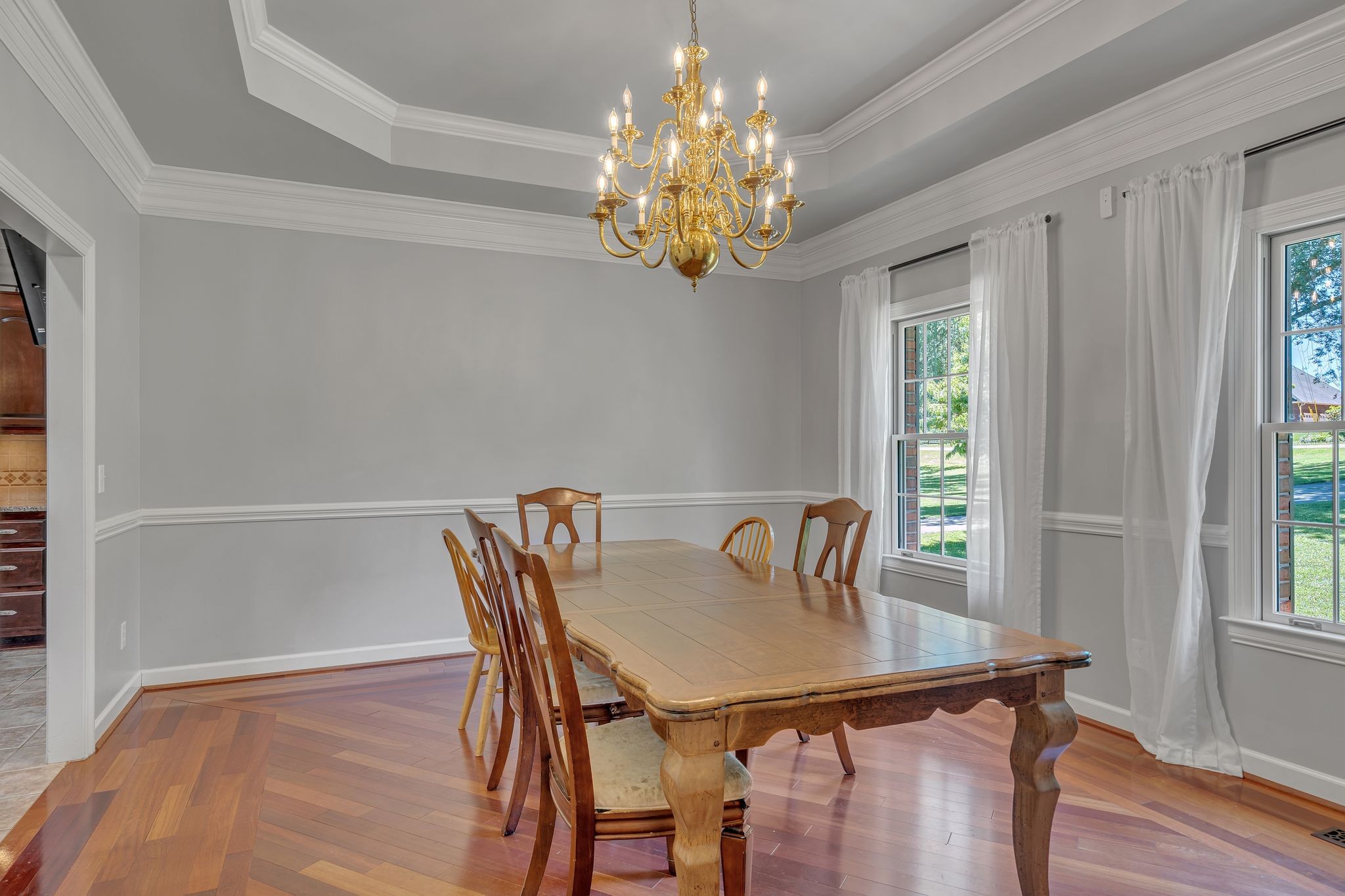 1651 Lawrence Lane Springfield, TN 37172 - Photo 15 of 56 a view of a dining room with furniture a chandelier and wooden floor