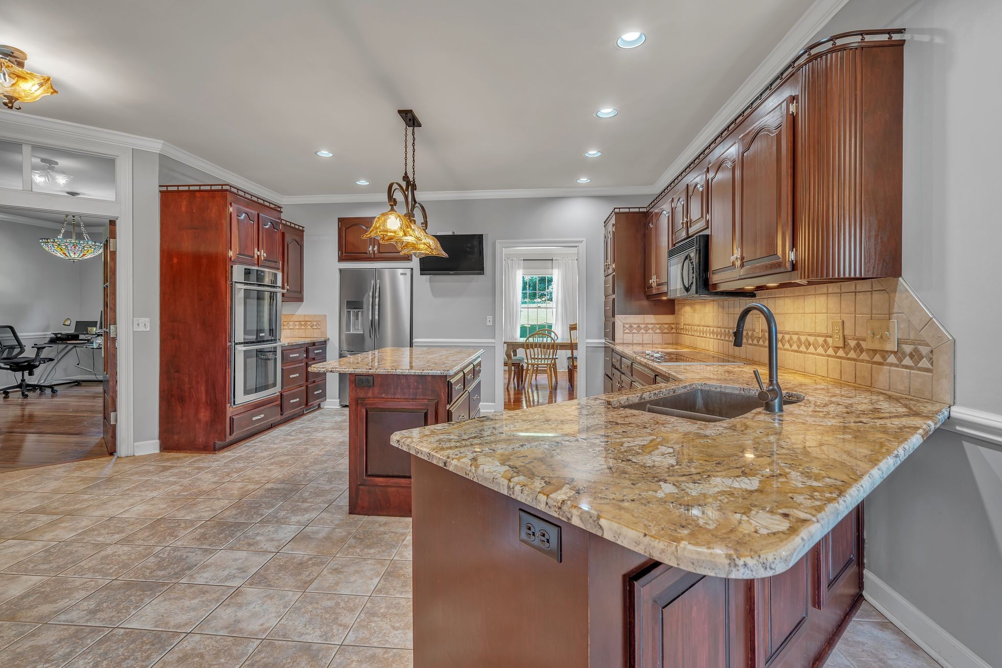1651 Lawrence Lane Springfield, TN 37172 - Photo 18 of 56 a kitchen with stainless steel appliances granite countertop a sink counter space and cabinets