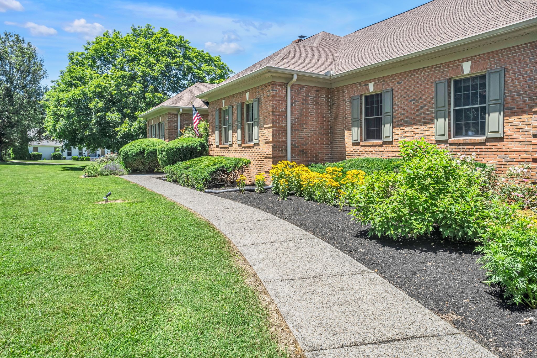 1651 Lawrence Lane Springfield, TN 37172 - Photo 3 of 56 a front view of a house with a yard and potted plants
