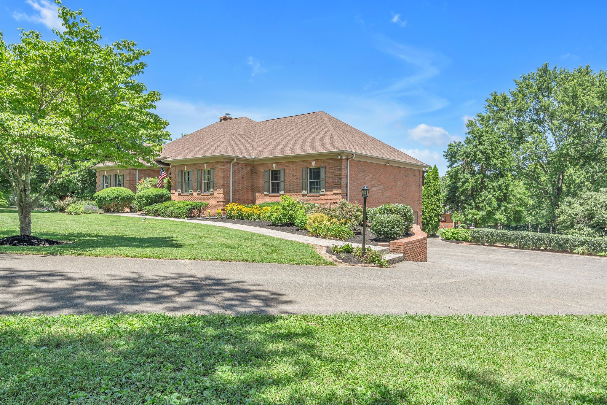 1651 Lawrence Lane Springfield, TN 37172 - Photo 5 of 56 a view of a house with a yard and a large tree center front of it