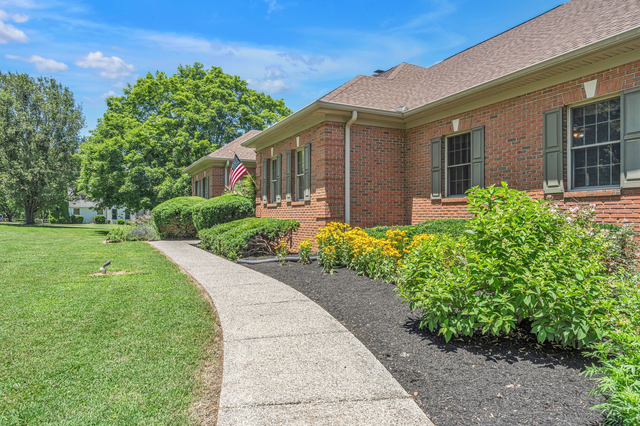 1651 Lawrence Lane Springfield, TN 37172 - Photo 6 of 56 a front view of a house with a garden