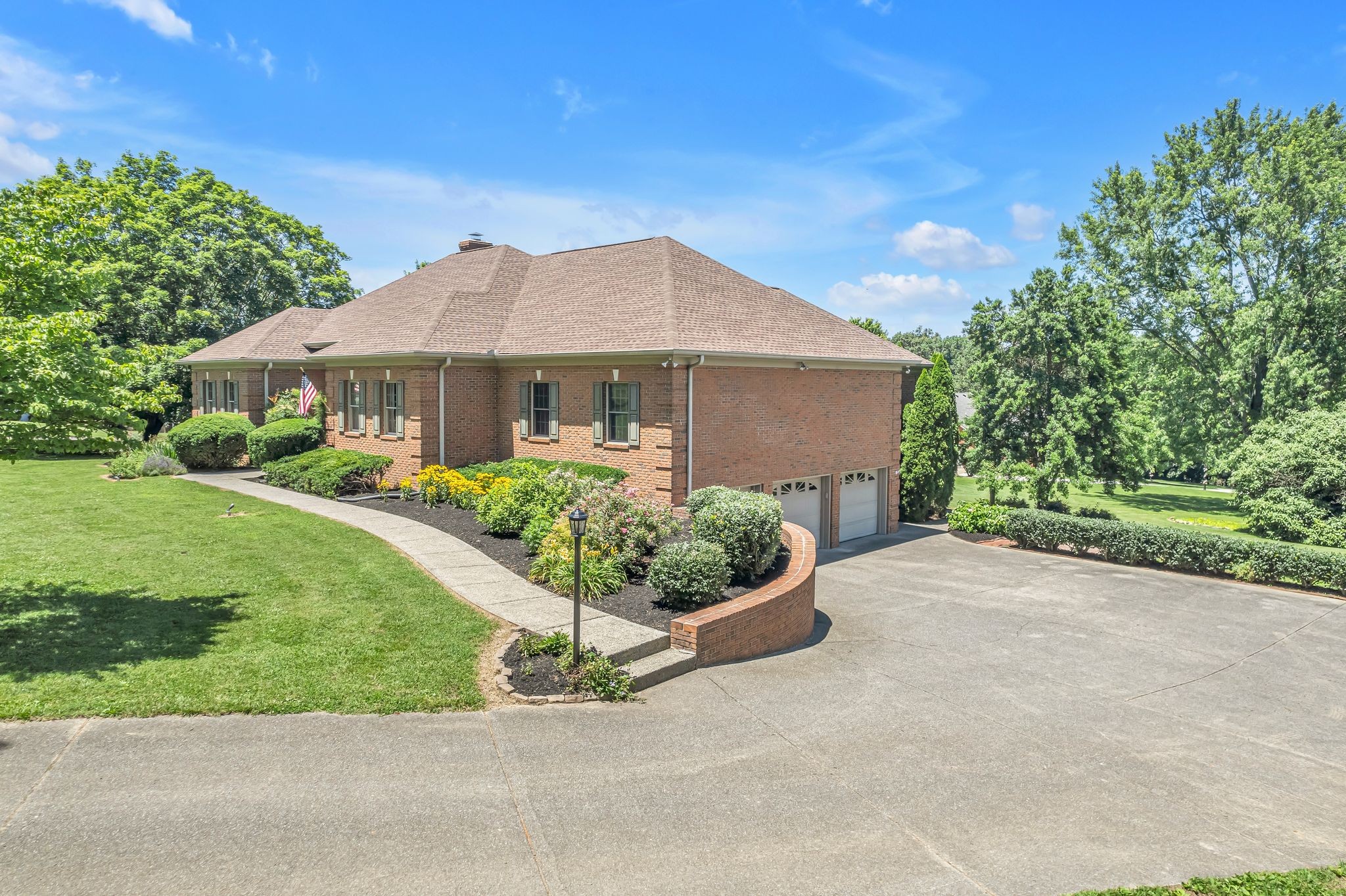 1651 Lawrence Lane Springfield, TN 37172 - Photo 9 of 56 a front view of a house with a yard and potted plants
