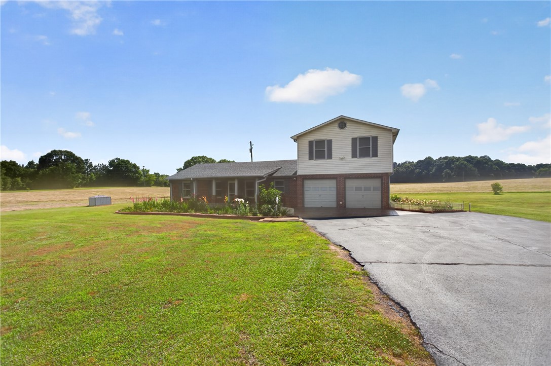145 State Rd S-4-935 Pendleton, SC 29670 - Photo 46 of 47 A classic brick residence offers a tranquil setting with ample green space and a convenient attached garage.