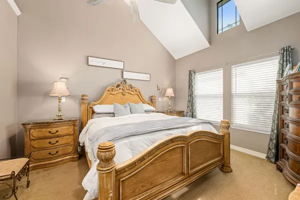 a bedroom with a bed and a chair