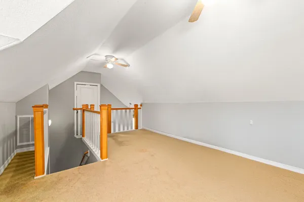 a view of a hallway with staircase
