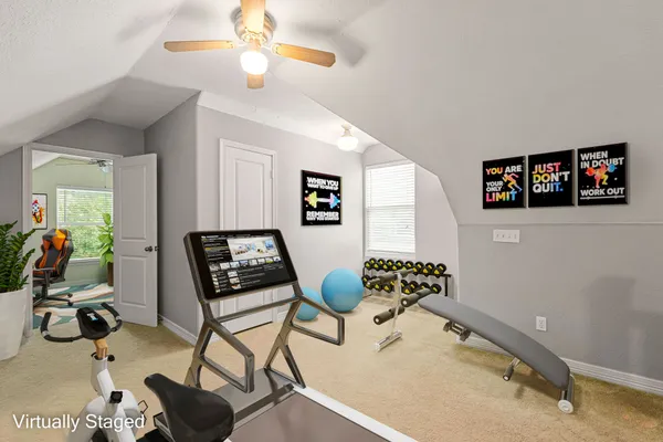 a bedroom with furniture and a chandelier