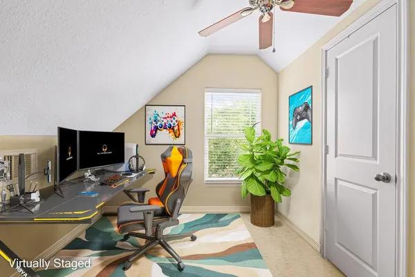 a work room with furniture and potted plants
