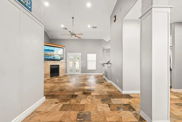 a view of an empty room with a fireplace