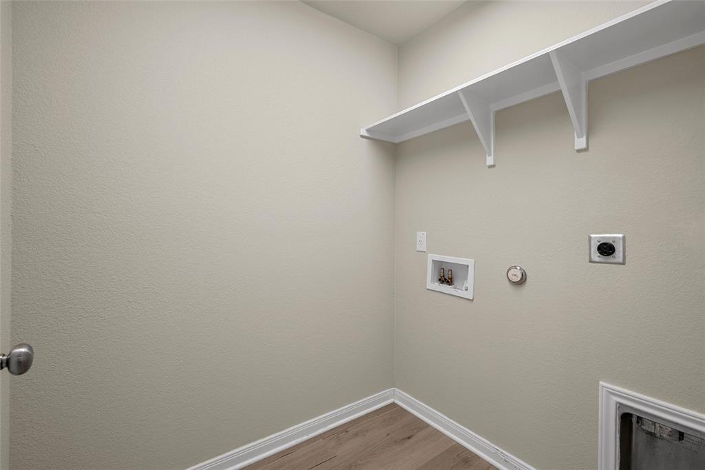 3205 Dottavio Road Lorena, TX 76655 - Photo 13 of 33 Dedicated laundry area featuring wood-finish flooring and neutral wall tones