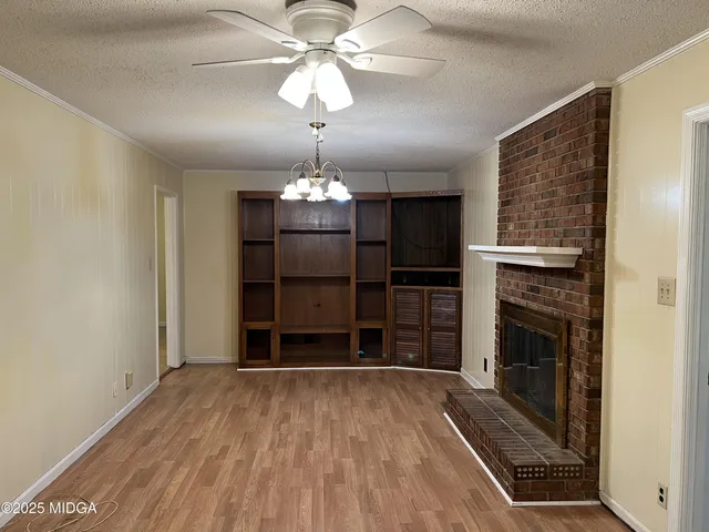 a kitchen with granite countertop a refrigerator and a sink
