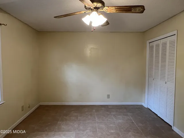 a view of a livingroom with a chandelier fan
