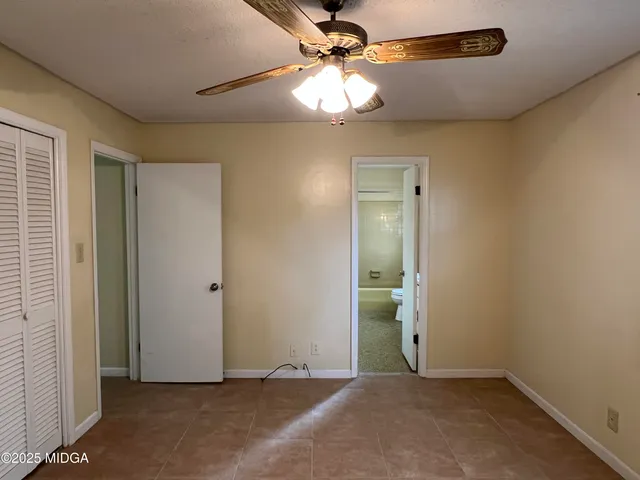 a view of a pathway of a building with a yard