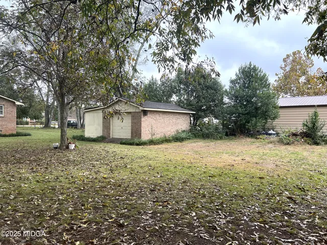 a house with trees in front of it