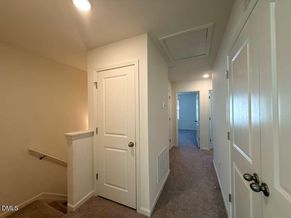 2048 Trailside Drive Durham, NC 27704 - Photo 15 of 27 a view of a hallway with wooden floor