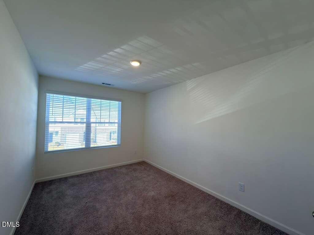 2048 Trailside Drive Durham, NC 27704 - Photo 23 of 27 an empty room with a window