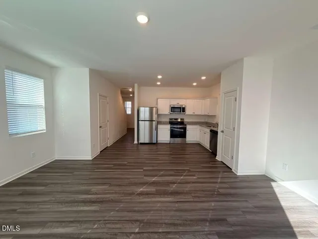 a view of kitchen with wooden floor