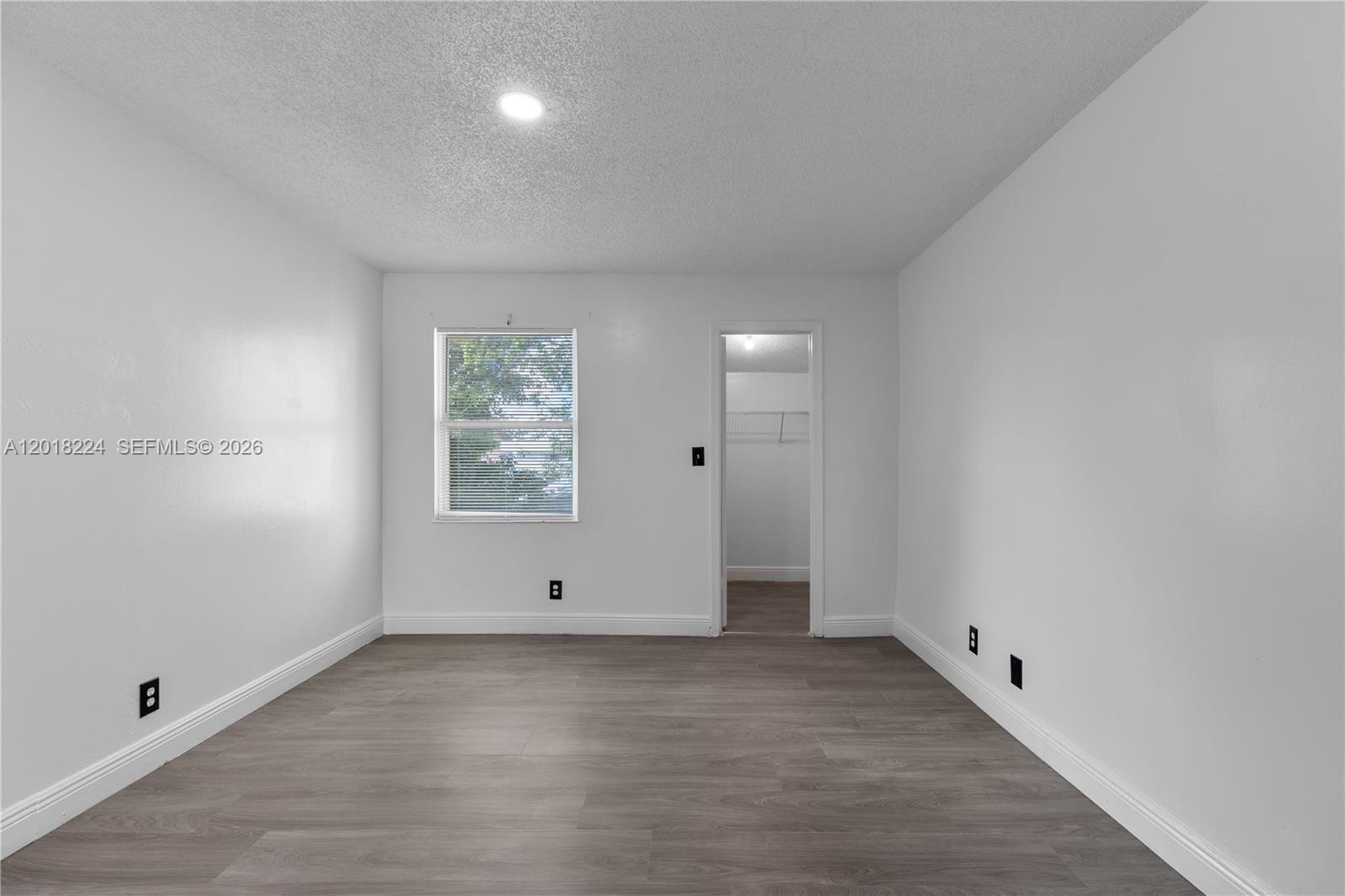 7958 Southwest 6th Street Pompano Beach, FL 33068 - Photo 22 of 57 a view of room with window and hardwood floor