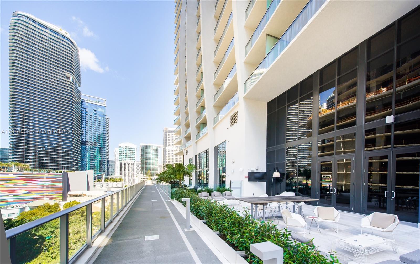 1010 Brickell Avenue, Unit 3002 Miami, FL 33131 - Photo 37 of 39 a view of a balcony with chairs