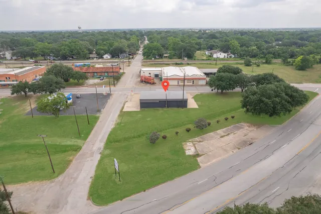 an aerial view of residential houses with outdoor space