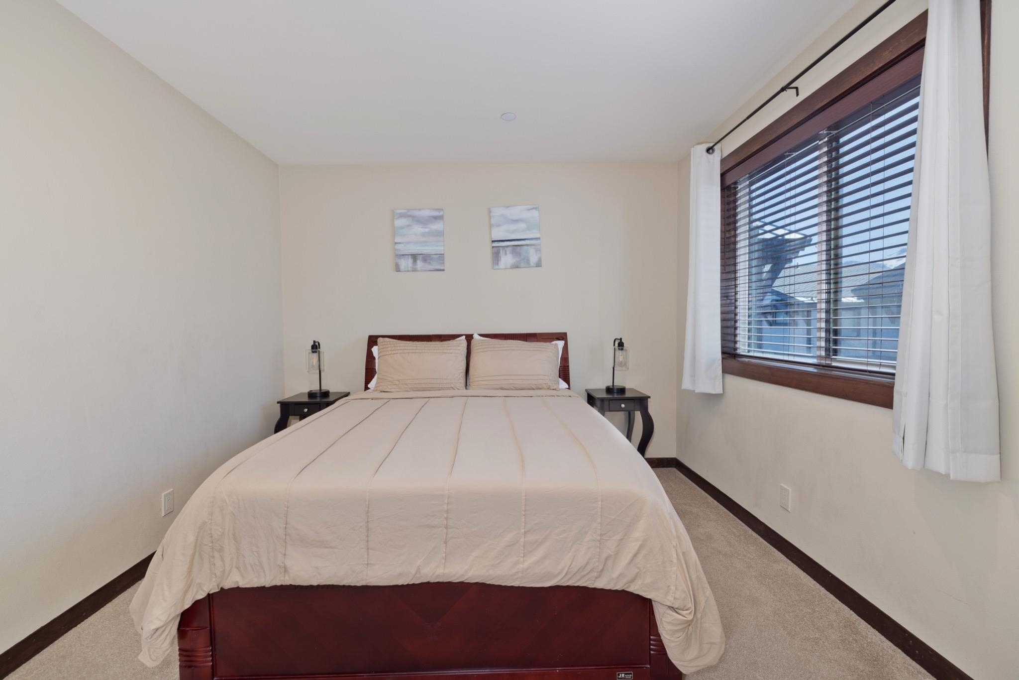 28 Oak Tree Way, Unit 8 Mammoth Lakes, CA 93546 - Photo 19 of 32 a bedroom with a bed and a window