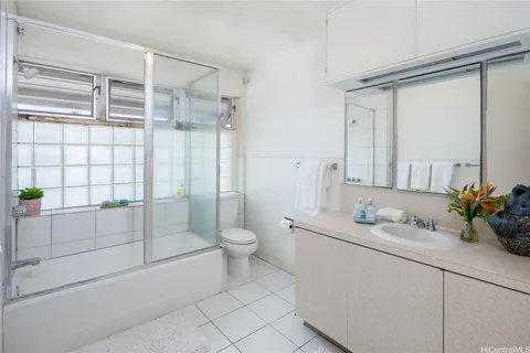 a spacious bedroom with a bed and a window