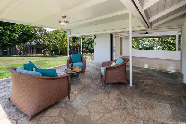 a close up of a vase of flowers sitting on a table