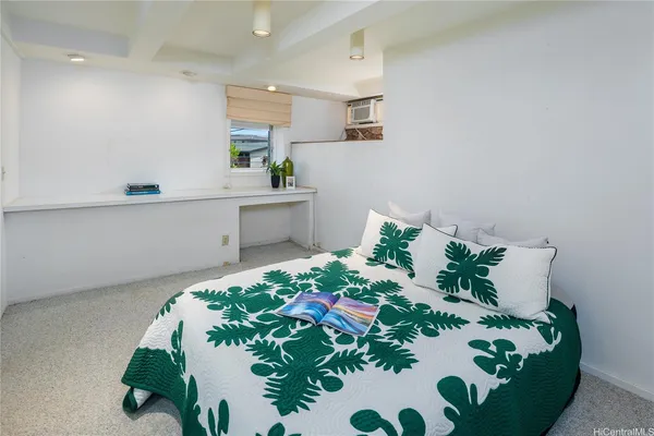 a kitchen with a sink a refrigerator and cabinets