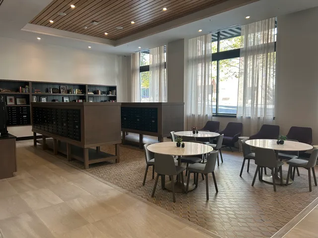 a view of a dining room with furniture and window