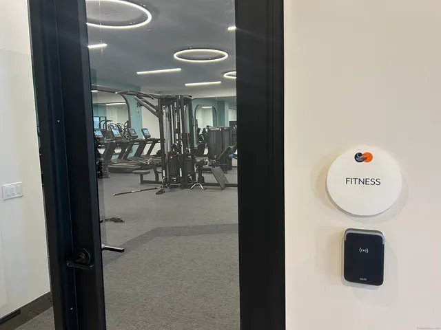 a large room with a table and chairs